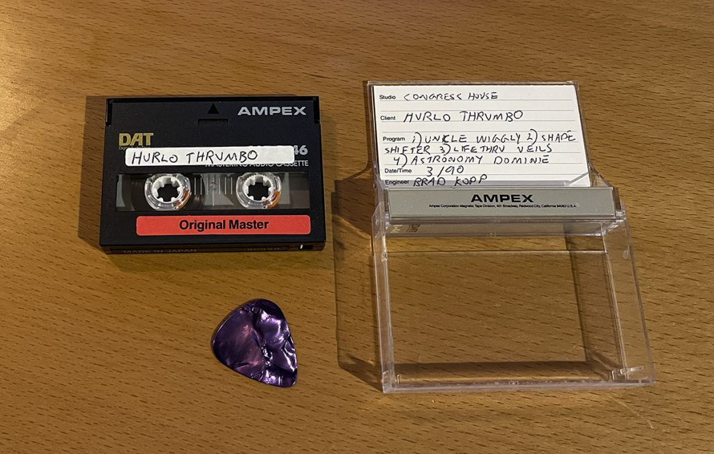 A digital audio cassette and its cover, circa 1990.